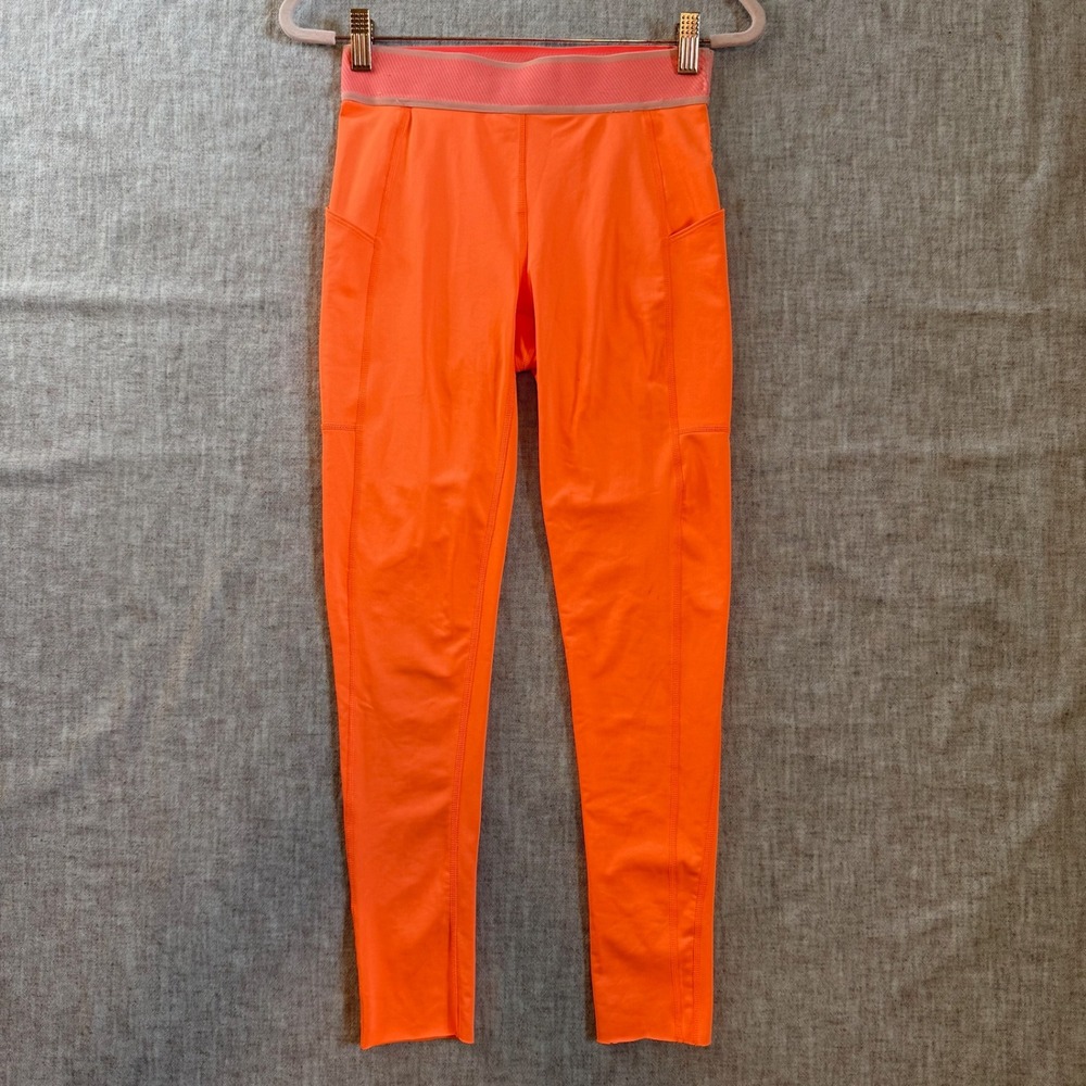 Free People Movement High Rise Leggings Small Neon Orange Side Pocket Raw Hem